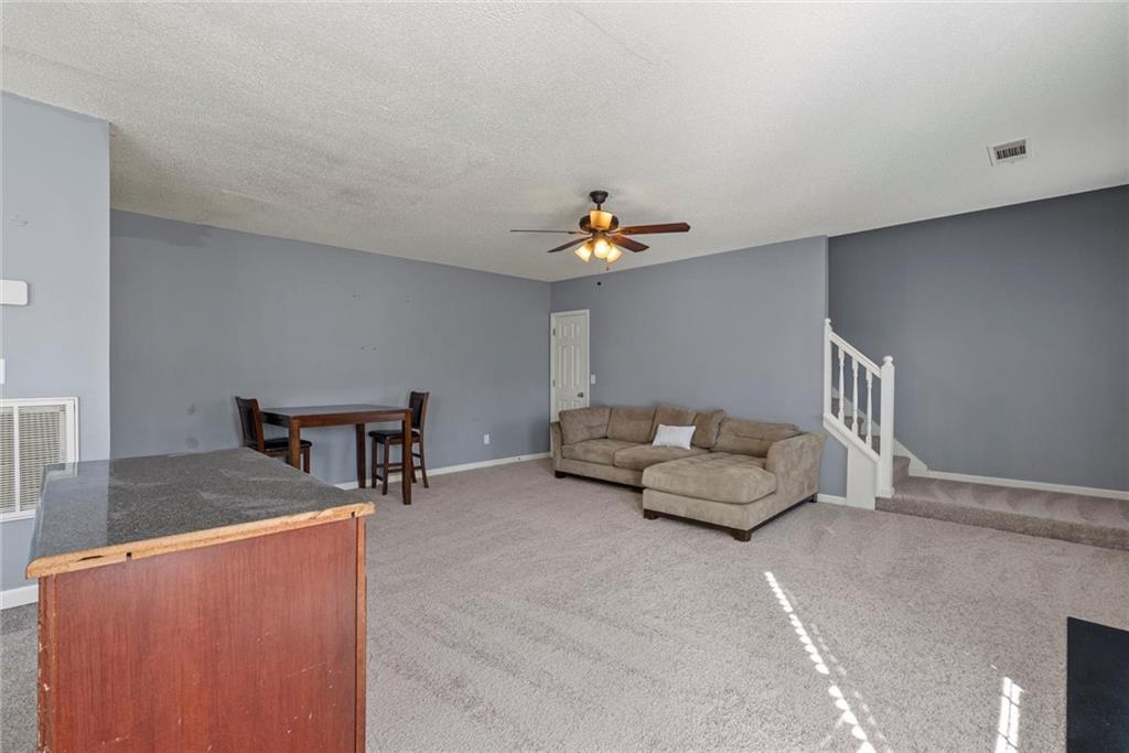 541 Hamlet Drive Hampton, GA 30228 - Photo 41 of 53 a living room with furniture and a table