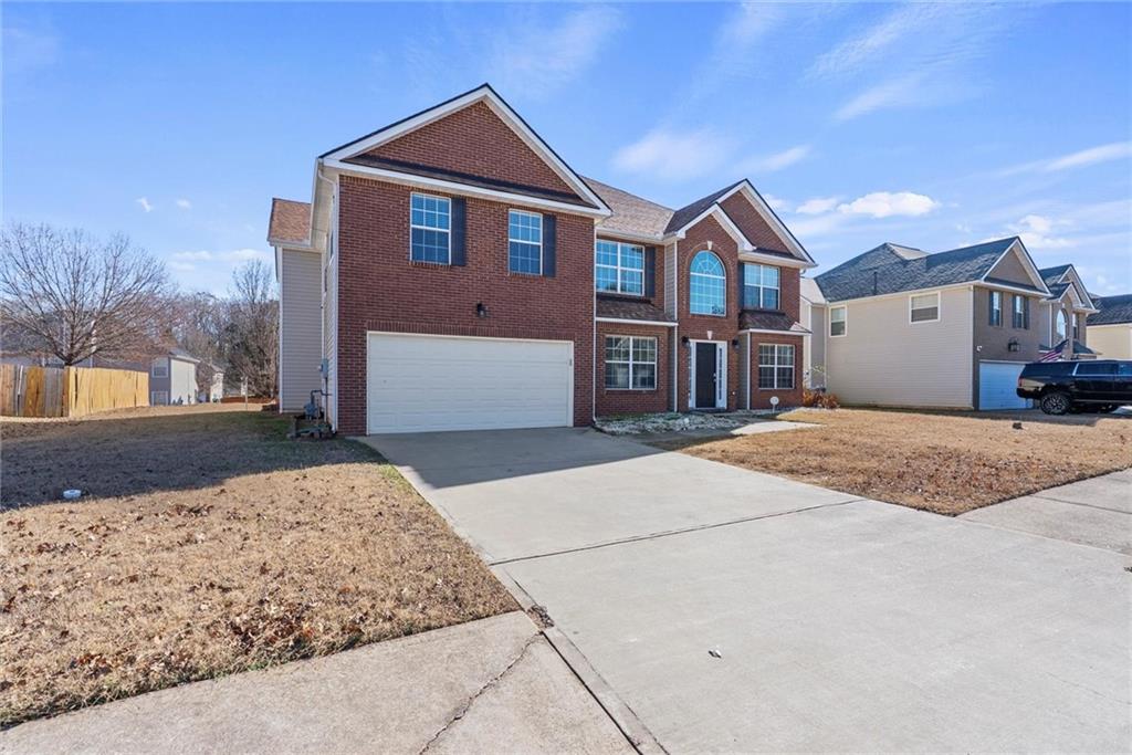 541 Hamlet Drive Hampton, GA 30228 - Photo 53 of 53 a front view of a house with a yard