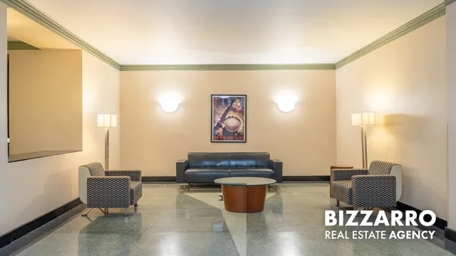 a utility room with dryer washer and a view of kitchen