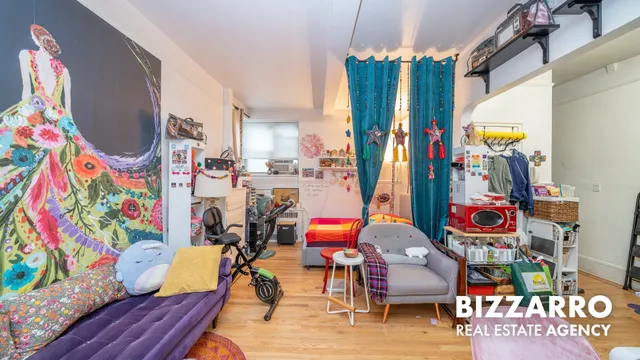 a reading room with furniture and wooden floor