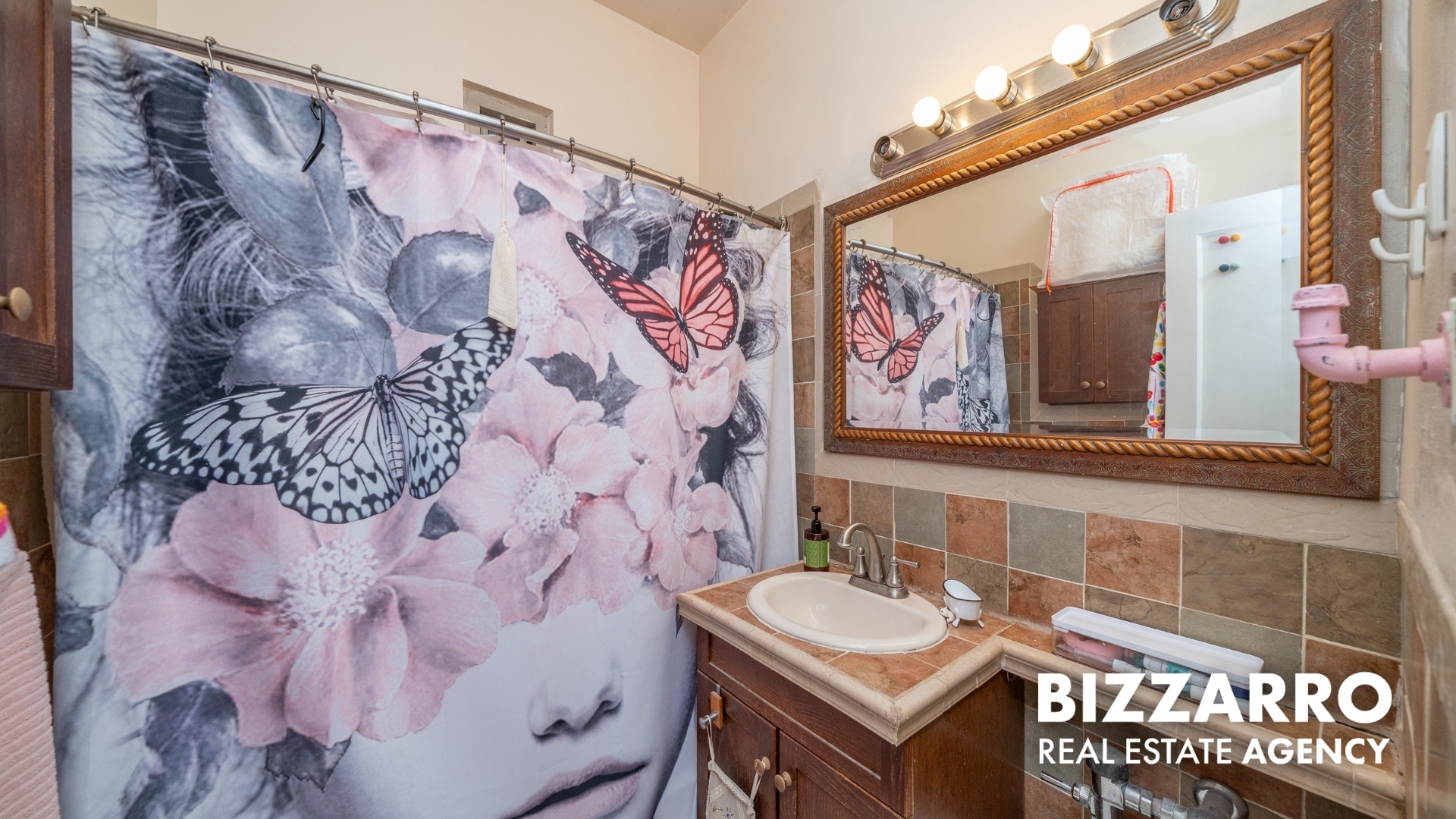 720 Fort Washington Avenue, Unit A Manhattan, NY 10040 - Photo 8 of 17 a bathroom with a sink and a mirror with painted walls