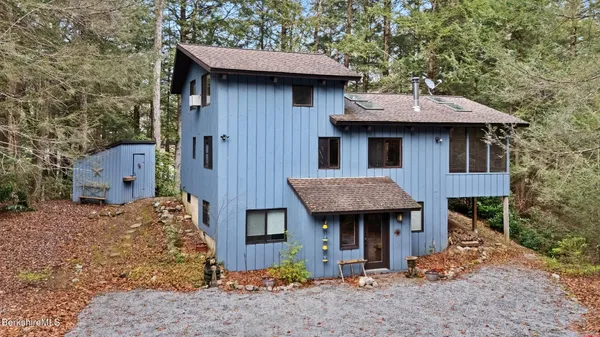 a brick house with a sink and a yard