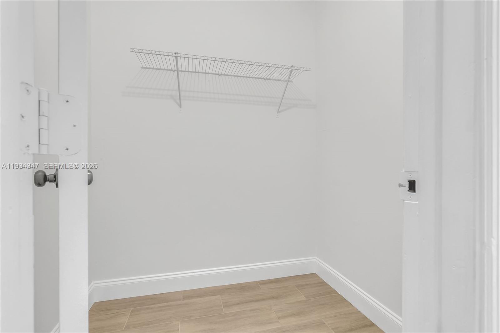 2501 Riverside Drive, Unit 307A Coral Springs, FL 33065 - Photo 15 of 28 a view of a room with racks on the wall