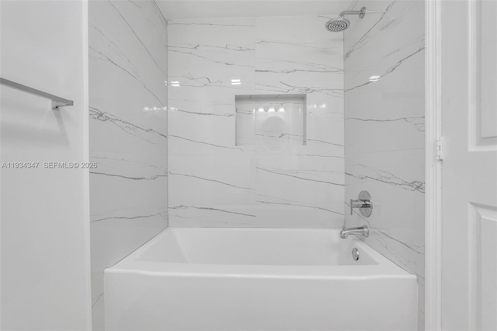 2501 Riverside Drive, Unit 307A Coral Springs, FL 33065 - Photo 17 of 28 a bathroom with a bathtub