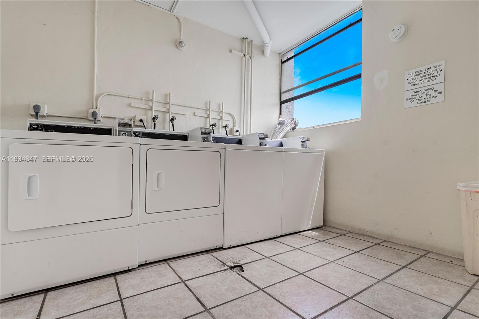 2501 Riverside Drive, Unit 307A Coral Springs, FL 33065 - Photo 19 of 28 a kitchen with a sink and cabinets
