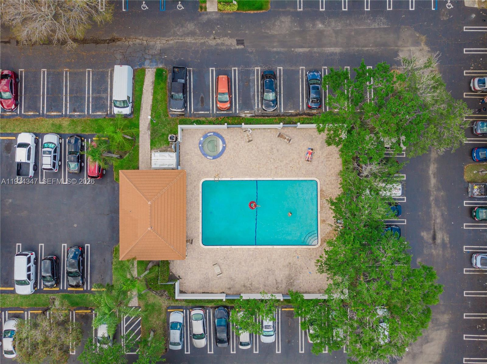 2501 Riverside Drive, Unit 307A Coral Springs, FL 33065 - Photo 21 of 28 front view of house with a yard and potted plants