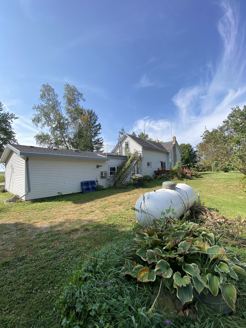 25914 Perkins Road Harvard, IL 60033 - Photo 4 of 6 a backyard of a house with lots of green space