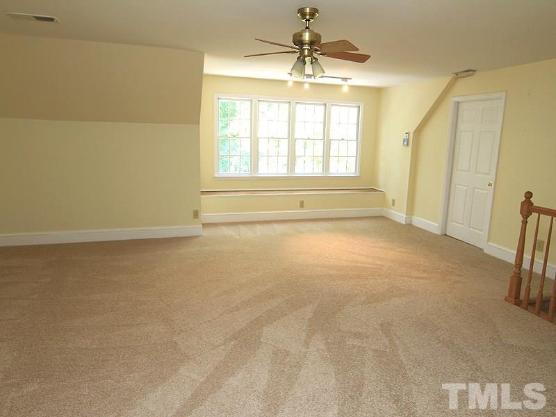 10609 Evergreen Chase Way Raleigh, NC 27613 - Photo 22 of 25 3rd floor finished recreation room with walk-in attic access.