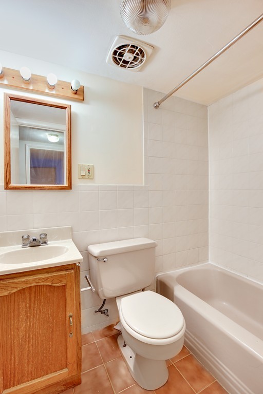 116 Sutherland Road, Unit 2A Boston, MA 02135 - Photo 12 of 14 a bathroom with a sink a toilet and a bathtub