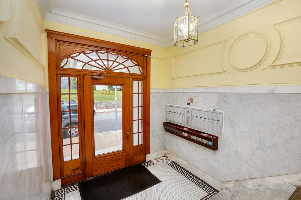 116 Sutherland Road, Unit 2A Boston, MA 02135 - Photo 3 of 14 a bathroom with a sink a mirror and a shower