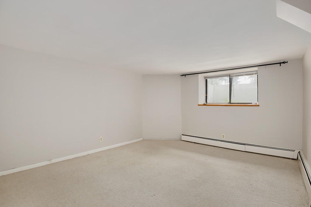 116 Sutherland Road, Unit 2A Boston, MA 02135 - Photo 8 of 14 an empty room with a window