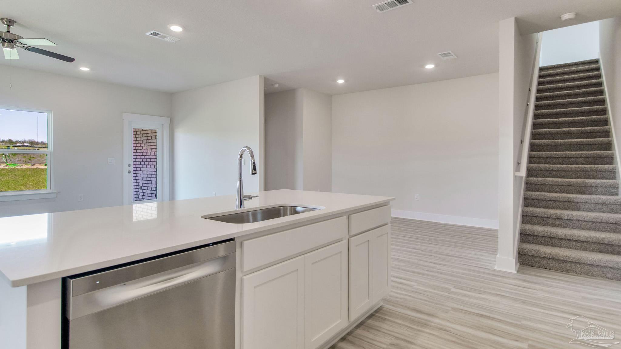 2733 Chevy Circle Pace, FL 32571 - Photo 11 of 37 a kitchen with a sink and cabinets