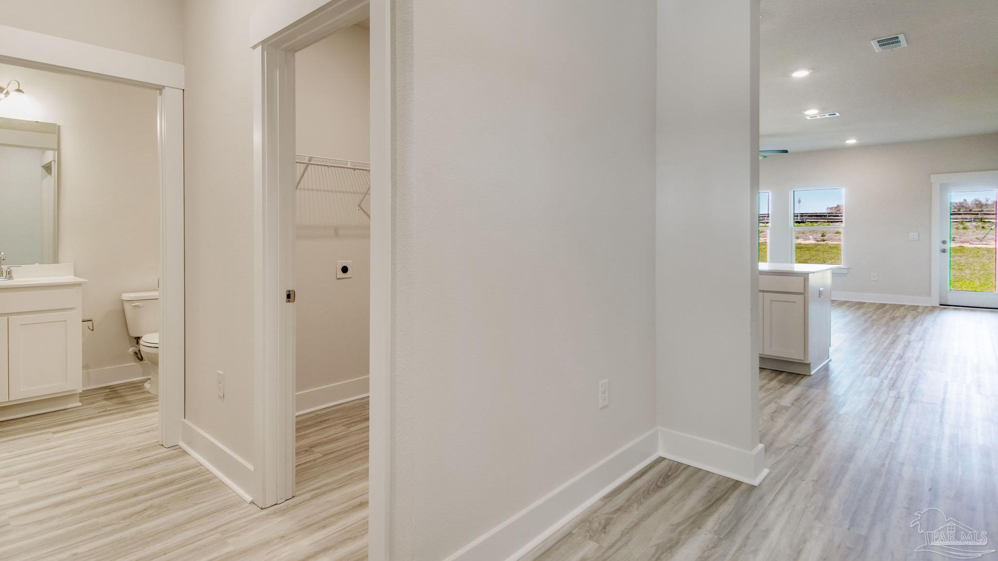 2733 Chevy Circle Pace, FL 32571 - Photo 13 of 37 a view of a hallway with wooden floor