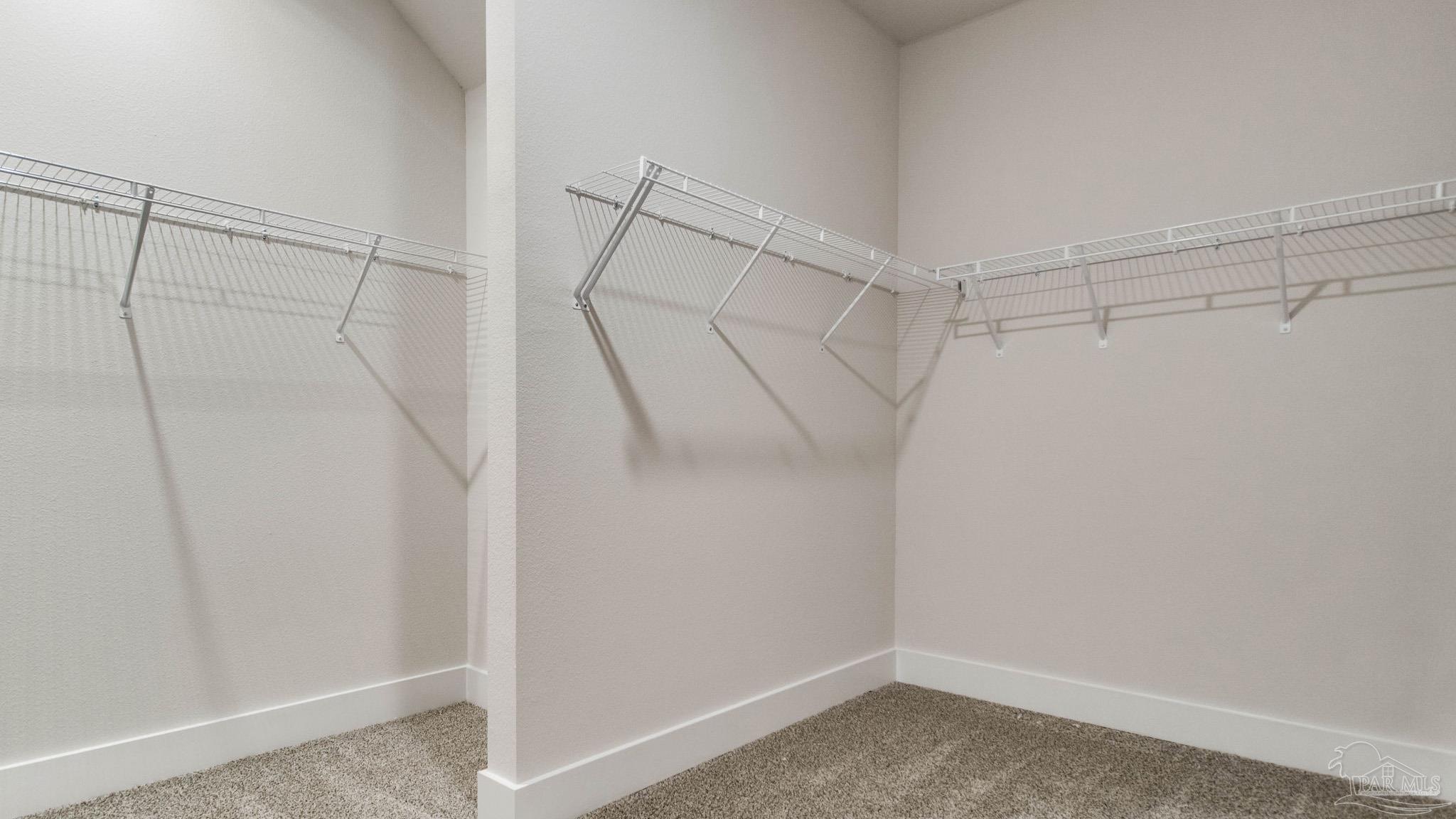 2733 Chevy Circle Pace, FL 32571 - Photo 23 of 37 a view of a room with racks on the wall