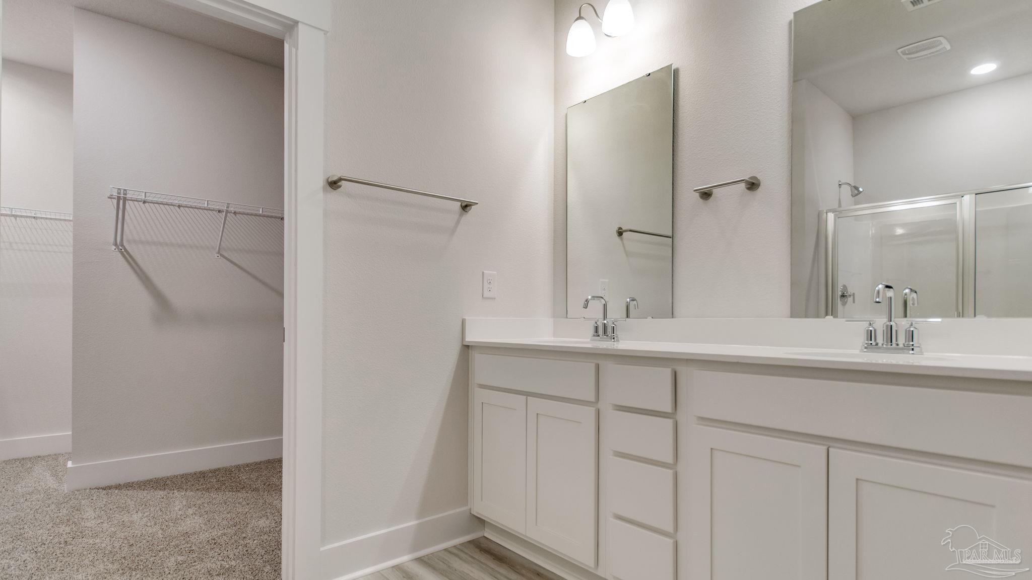 2733 Chevy Circle Pace, FL 32571 - Photo 24 of 37 a bathroom with a double vanity sink and mirror