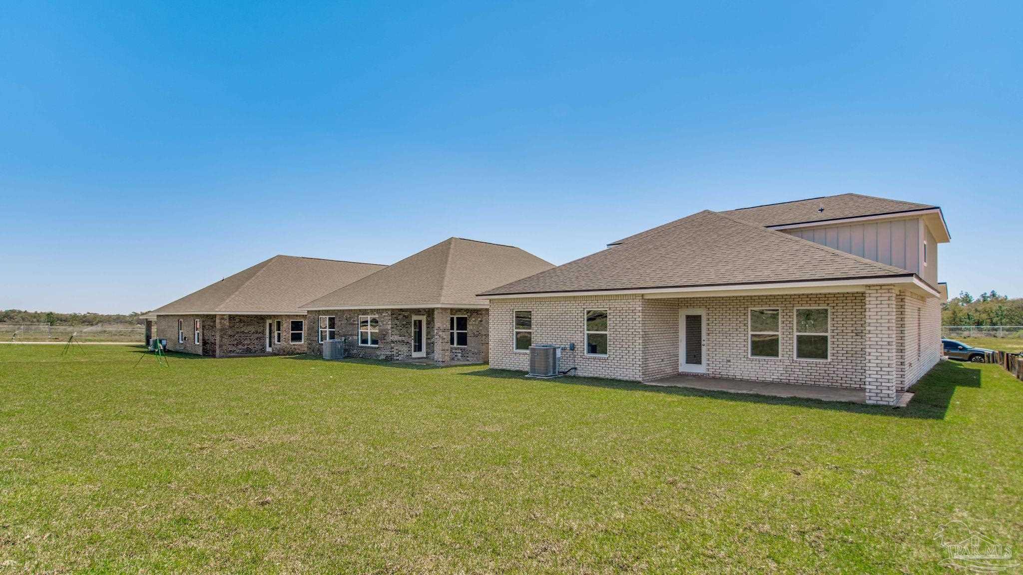 2733 Chevy Circle Pace, FL 32571 - Photo 3 of 37 a view of a house with a yard and sitting area