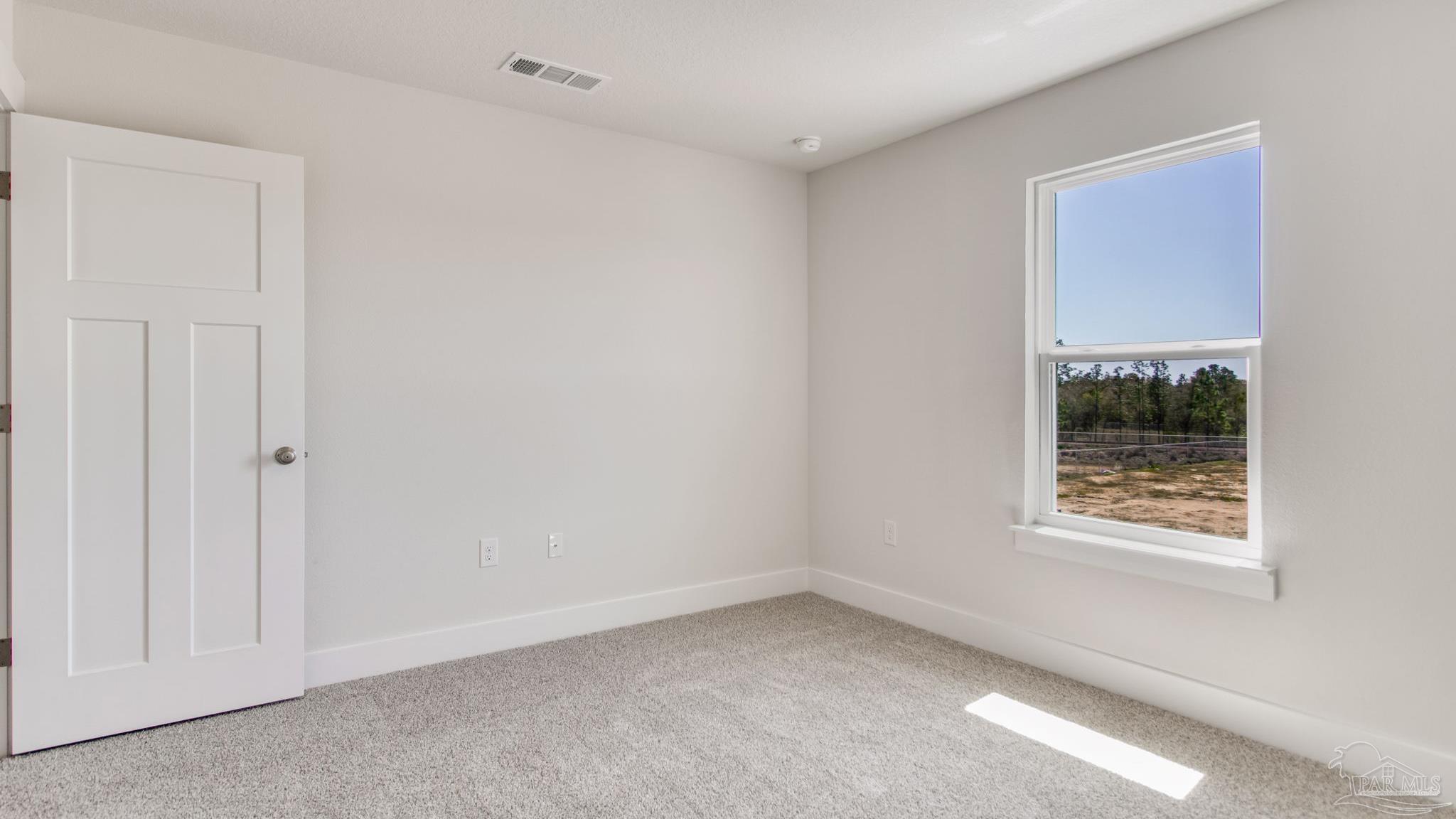 2733 Chevy Circle Pace, FL 32571 - Photo 33 of 37 a view of an empty room with a window