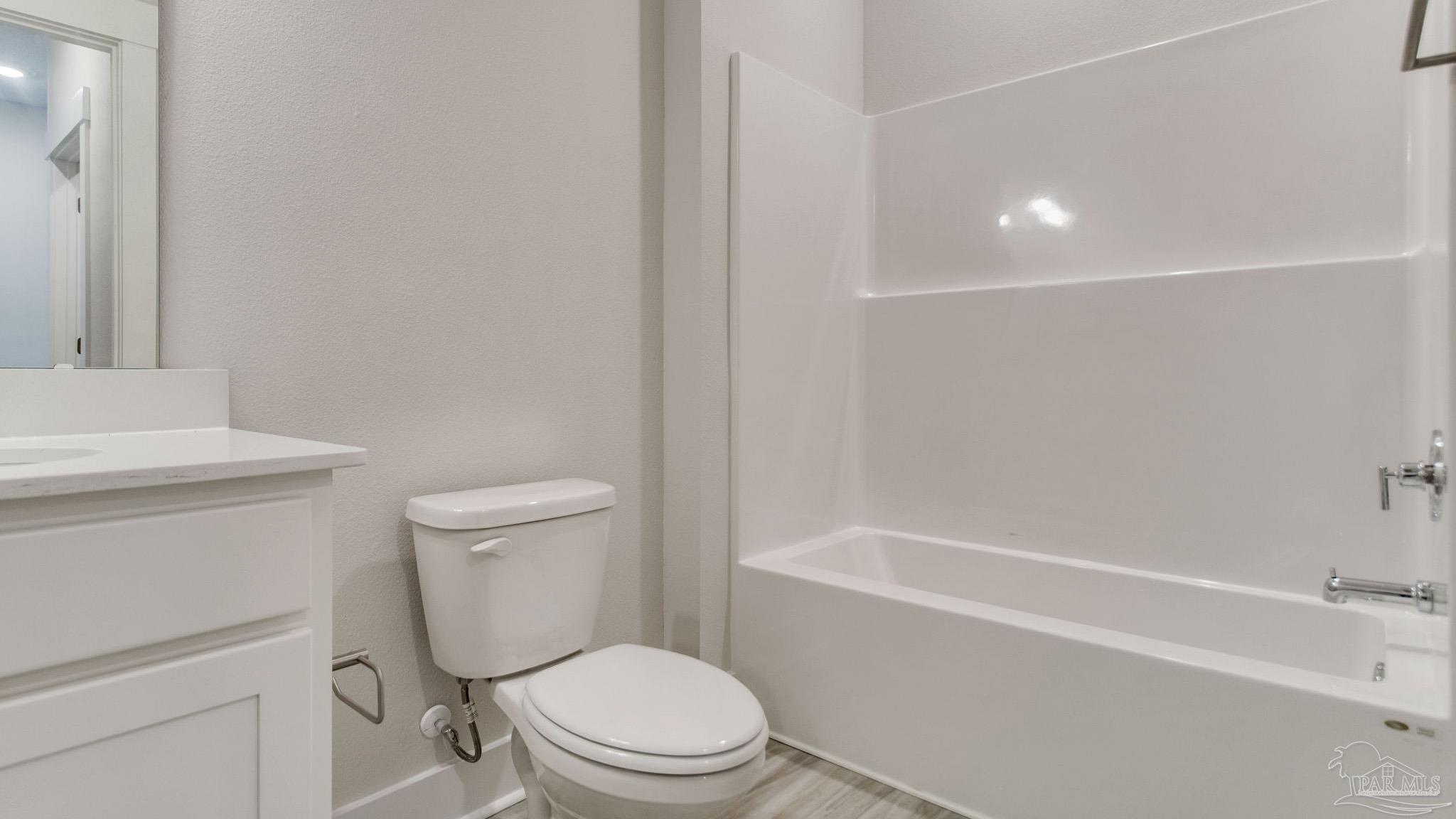 2733 Chevy Circle Pace, FL 32571 - Photo 35 of 37 a white toilet sitting next to a bath tub