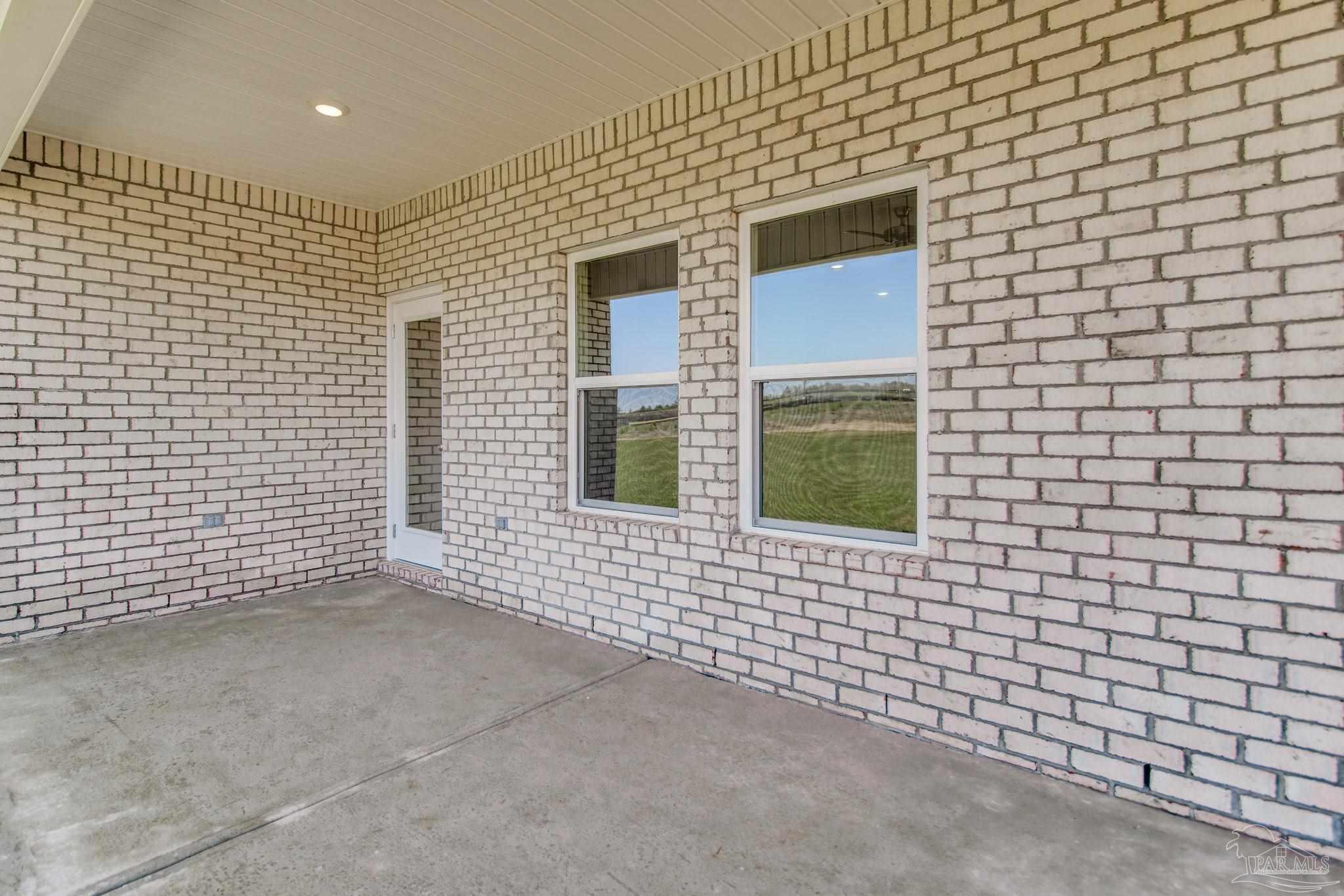 2733 Chevy Circle Pace, FL 32571 - Photo 36 of 37 a view of a brick house with a large window