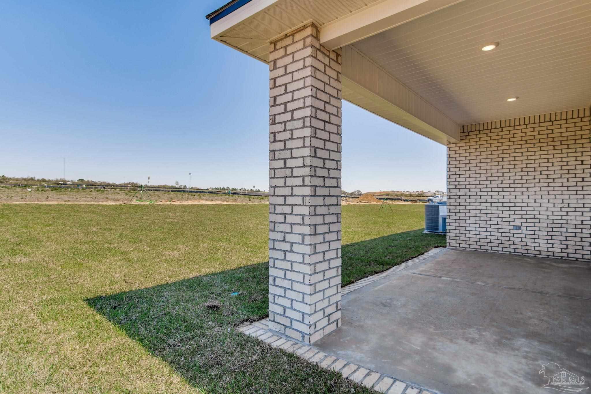 2733 Chevy Circle Pace, FL 32571 - Photo 37 of 37 a view of a balcony with an outdoor space and seating area