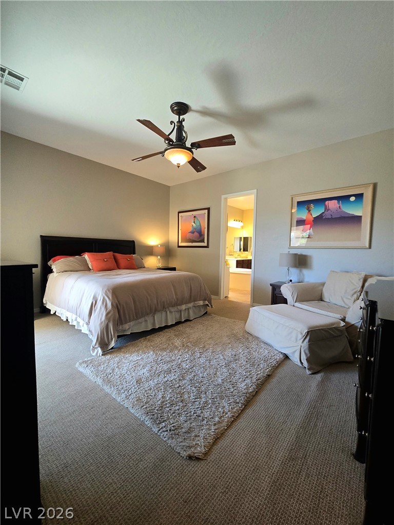 2567 Dirleton Place Henderson, NV 89044 - Photo 30 of 67 Comfortable carpeting and a ceiling fan create a serene and inviting atmosphere for peaceful slumber.