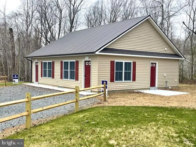 a house that has a large pool in front of it
