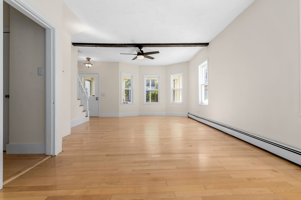 14 1/2 Hampshire Street Danvers, MA 01923 - Photo 15 of 37 a view of an empty room with window and wooden floor