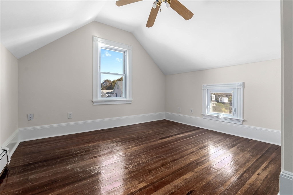 14 1/2 Hampshire Street Danvers, MA 01923 - Photo 18 of 37 a view of an empty room with wooden floor and a window