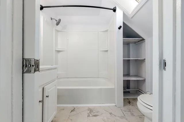 a bathroom with a sink a mirror and a bathtub