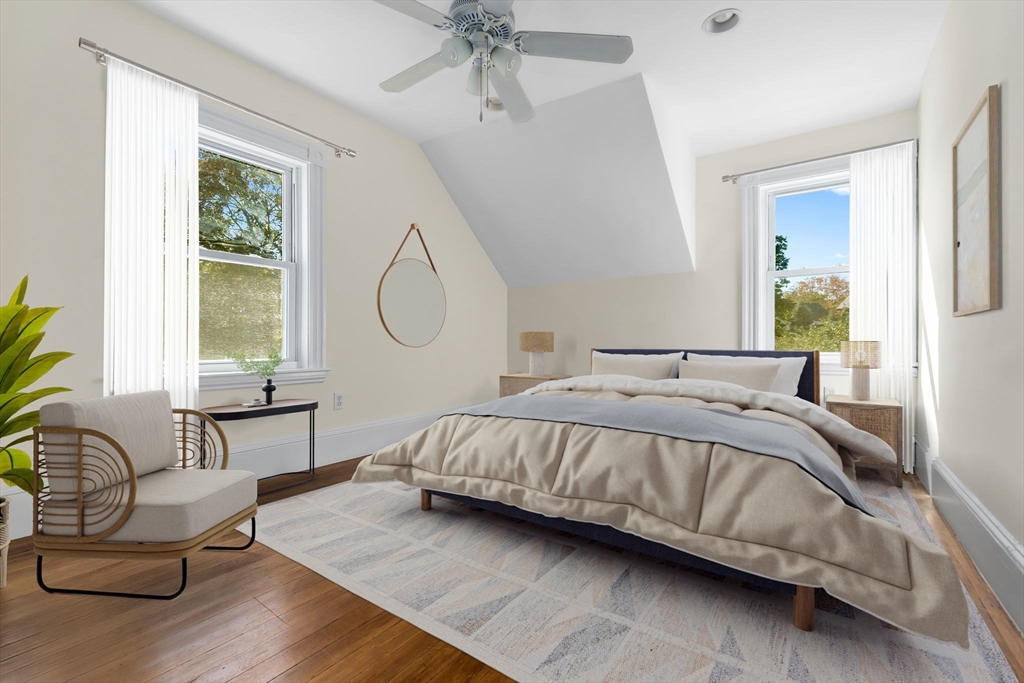 14 1/2 Hampshire Street Danvers, MA 01923 - Photo 23 of 37 a bed sitting in a bedroom next to a window