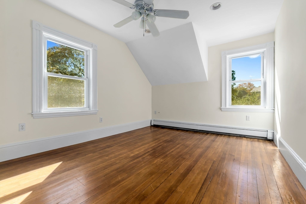 14 1/2 Hampshire Street Danvers, MA 01923 - Photo 26 of 37 a view of an empty room with wooden floor and a window