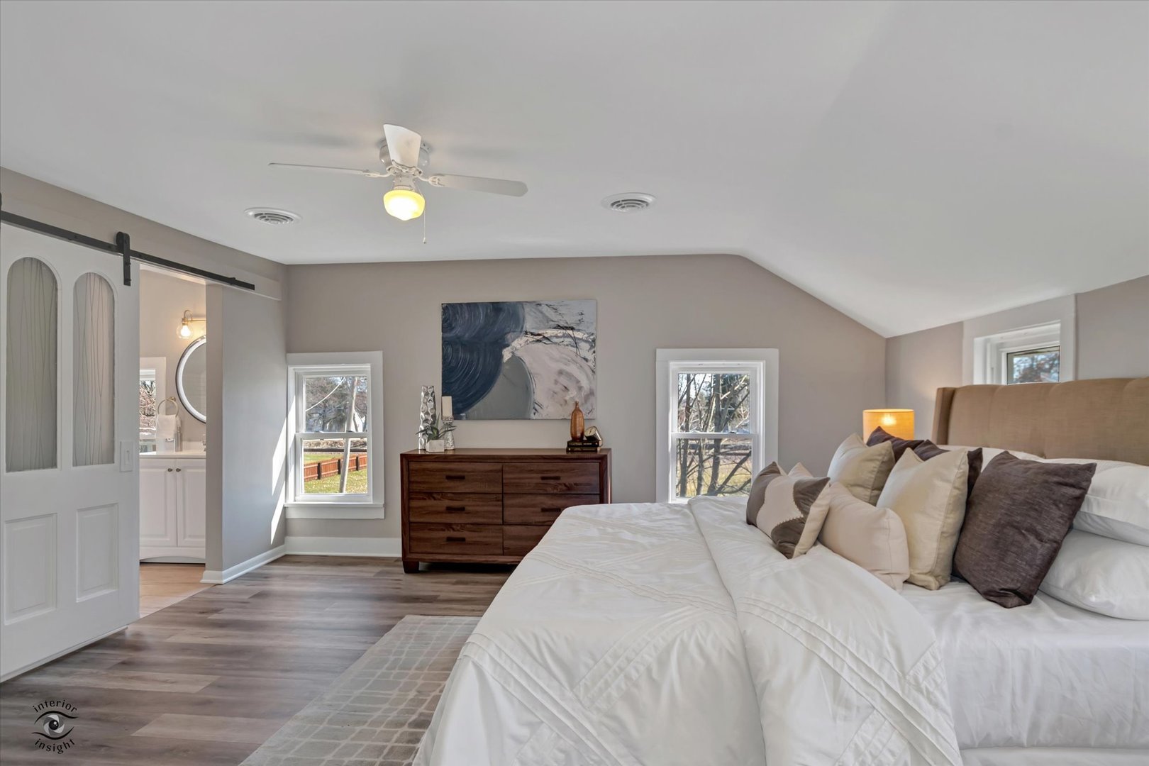 714 Gould Street Beecher, IL 60401 - Photo 24 of 29 a bedroom with a large bed and wooden floor