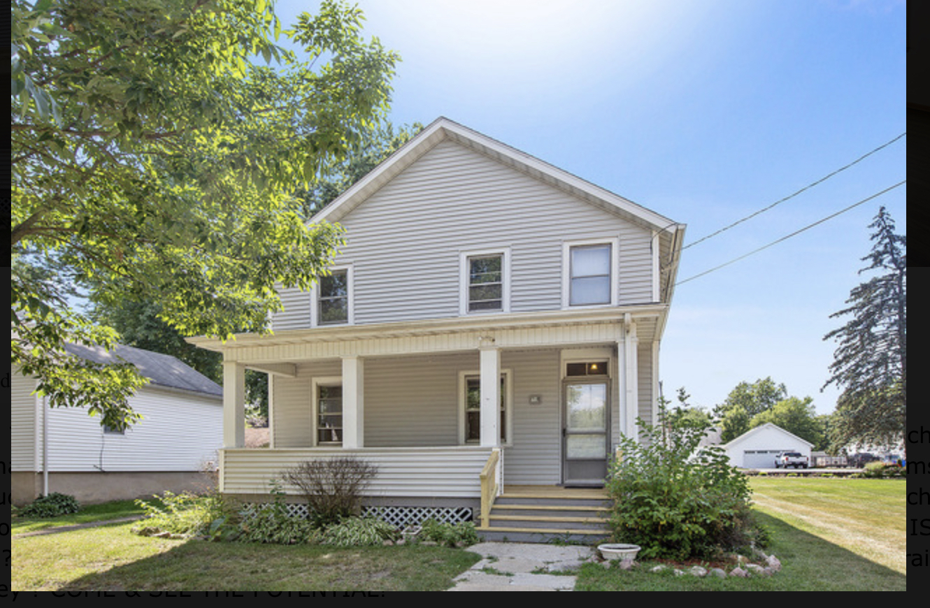 714 Gould Street Beecher, IL 60401 - Photo 28 of 29 a front view of a house with a yard garage and outdoor seating