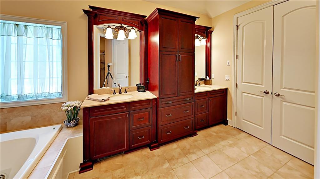 811 Mt Pleasant Road Mars, PA 16046 - Photo 12 of 25 a bathroom with a tub sink and mirror