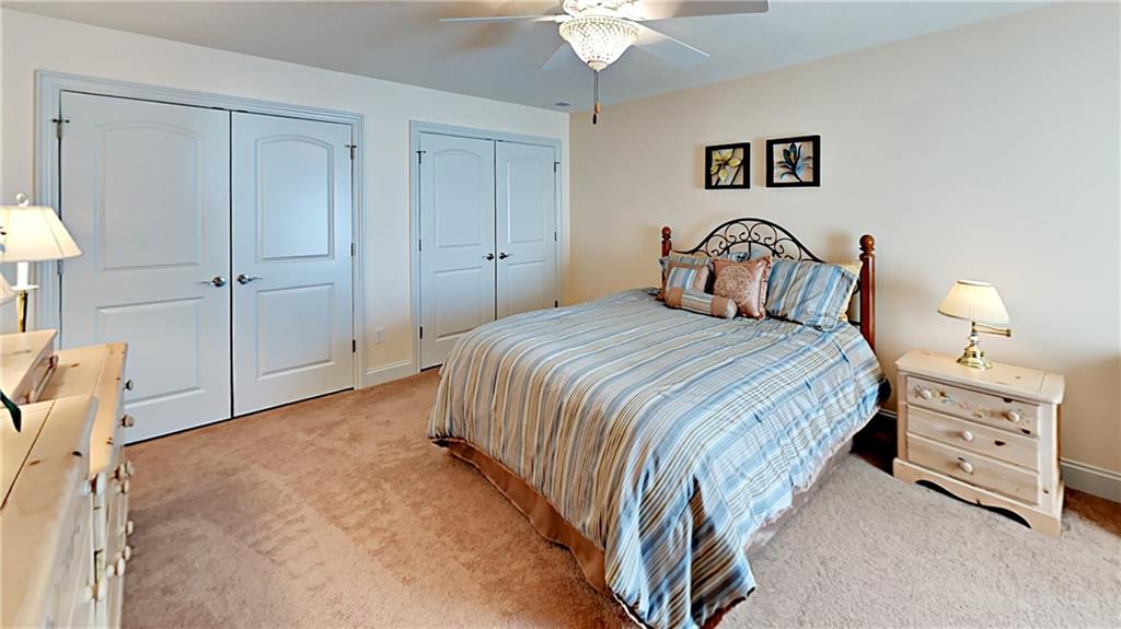 811 Mt Pleasant Road Mars, PA 16046 - Photo 18 of 25 a bedroom with a bed and a chandelier