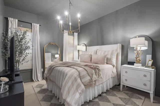 a bed room with a bed and a mirror