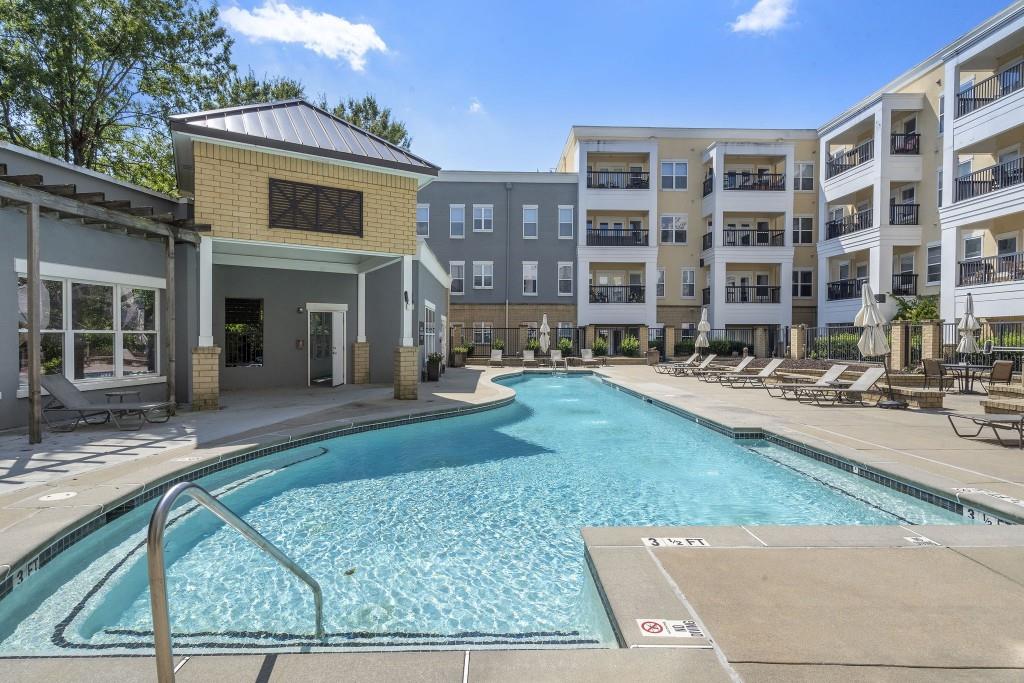 870 Inman Vlg Parkway Northeast, Unit 212 Atlanta, GA 30307 - Photo 18 of 23 a front view of building with yard