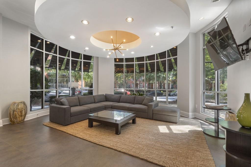 870 Inman Vlg Parkway Northeast, Unit 212 Atlanta, GA 30307 - Photo 19 of 23 a living room with furniture and a large window