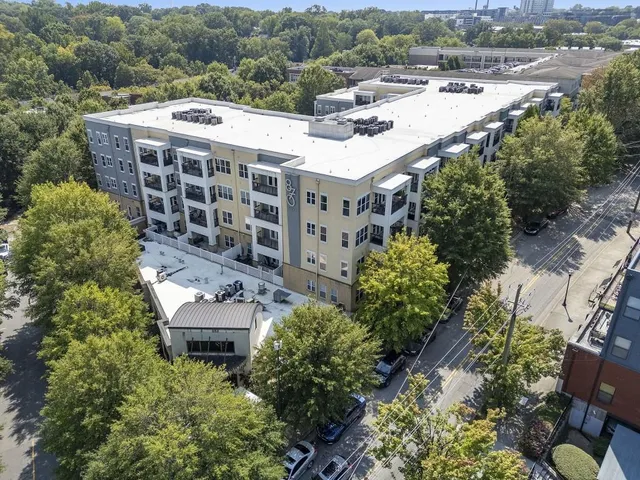 an aerial view of building with trees
