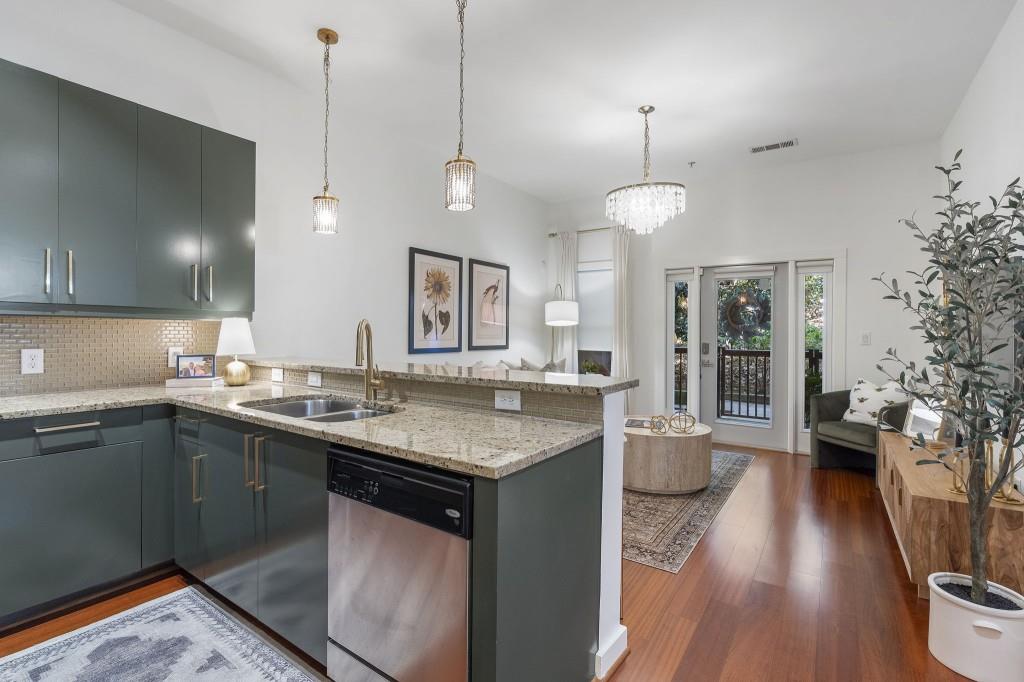 870 Inman Vlg Parkway Northeast, Unit 212 Atlanta, GA 30307 - Photo 10 of 23 a kitchen with a sink stove and wooden floor
