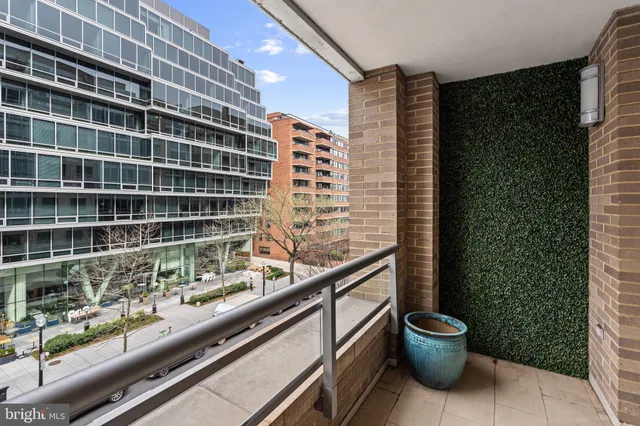 a dining room with furniture a chandelier and wooden floor