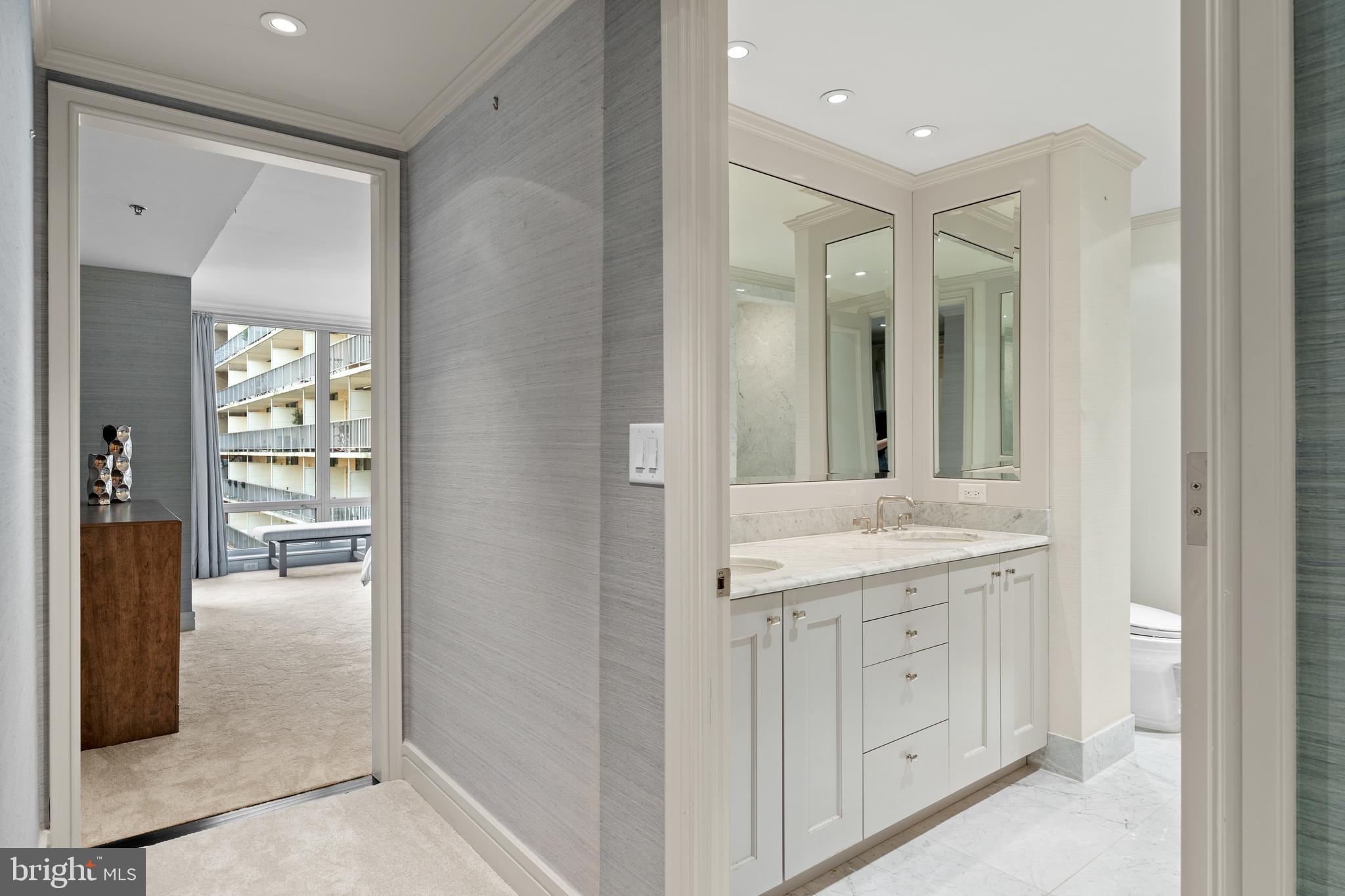1111 23rd Street Northwest, Unit 4C Washington, DC 20037 - Photo 28 of 39 a bathroom with a granite countertop sink mirror and shower