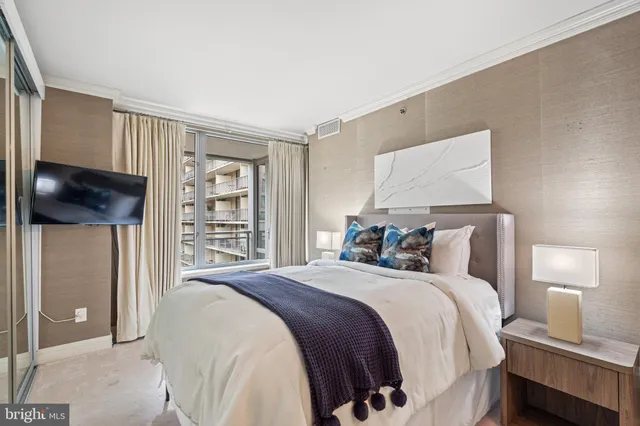 a bedroom with a bed and a lamp