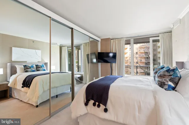 a bathroom with a shower sink and mirror