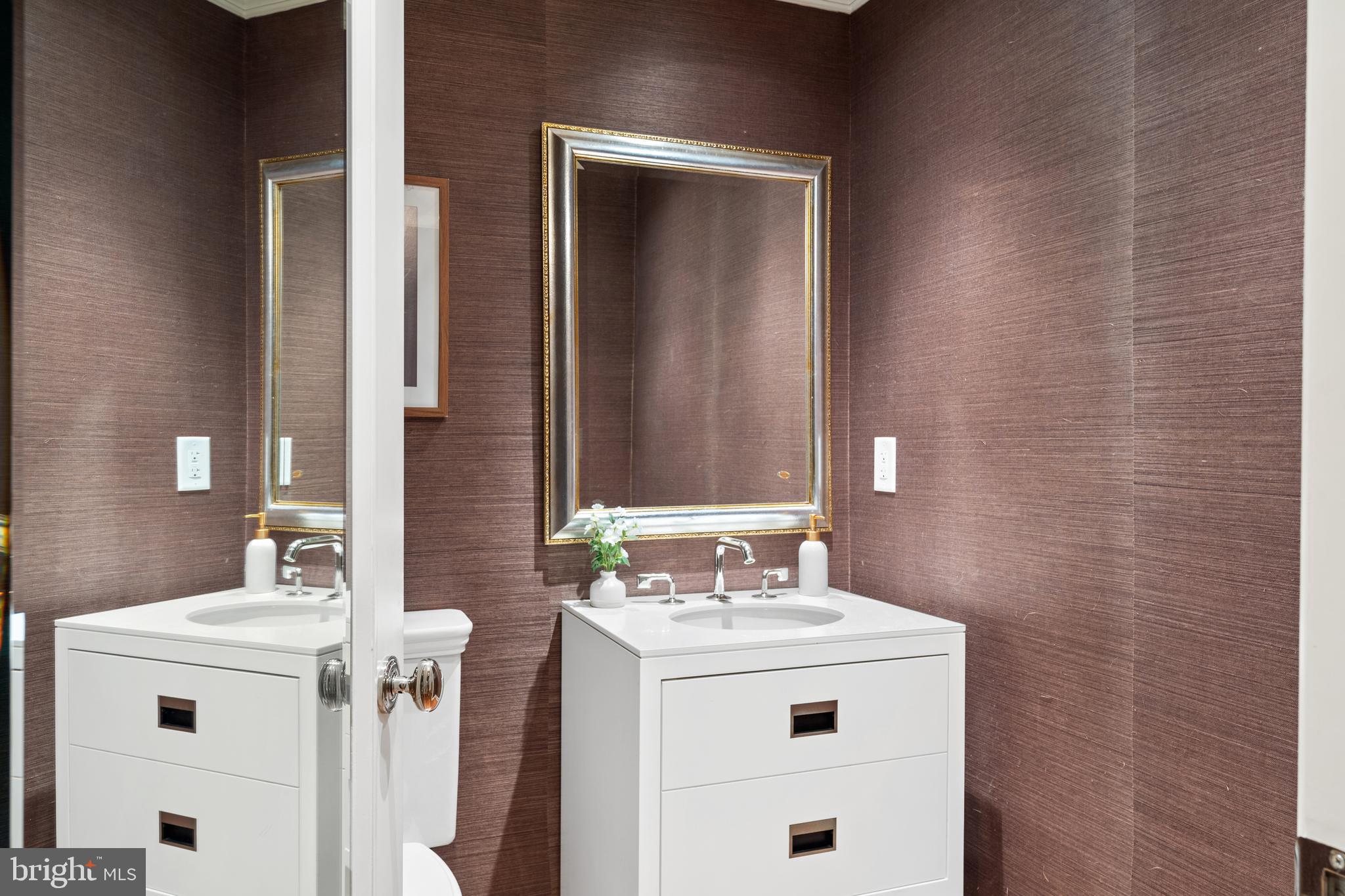 1111 23rd Street Northwest, Unit 4C Washington, DC 20037 - Photo 35 of 39 a bathroom with a sink and a mirror