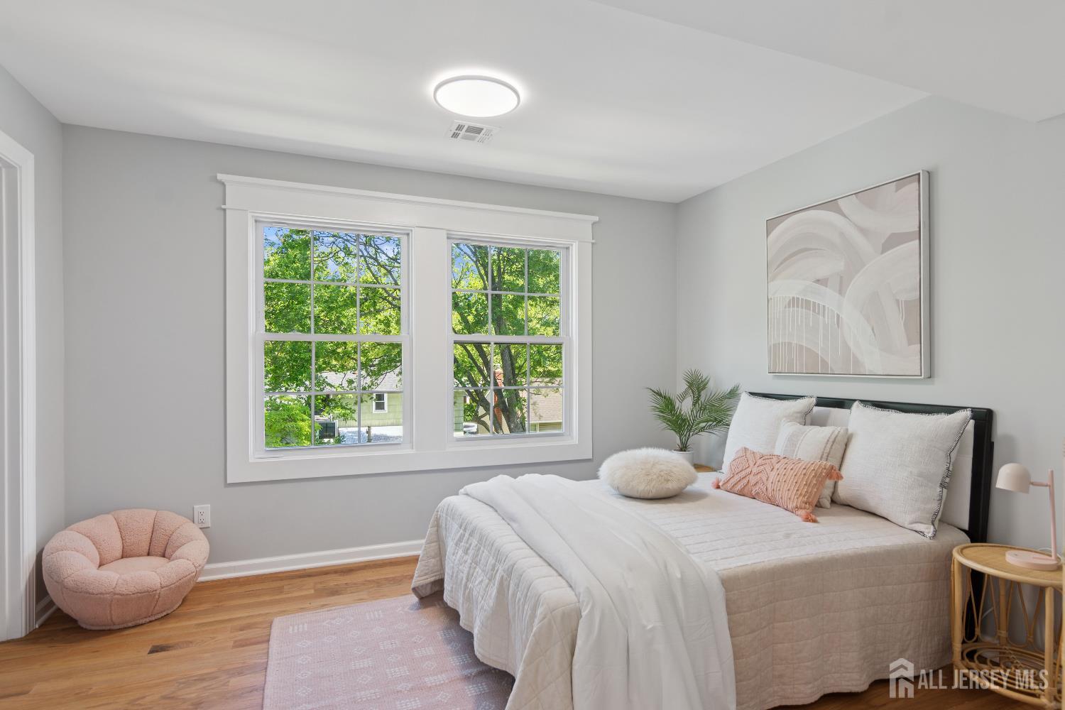831 West Inman Avenue Rahway, NJ 07065 - Photo 12 of 35 a bedroom with a bed and window