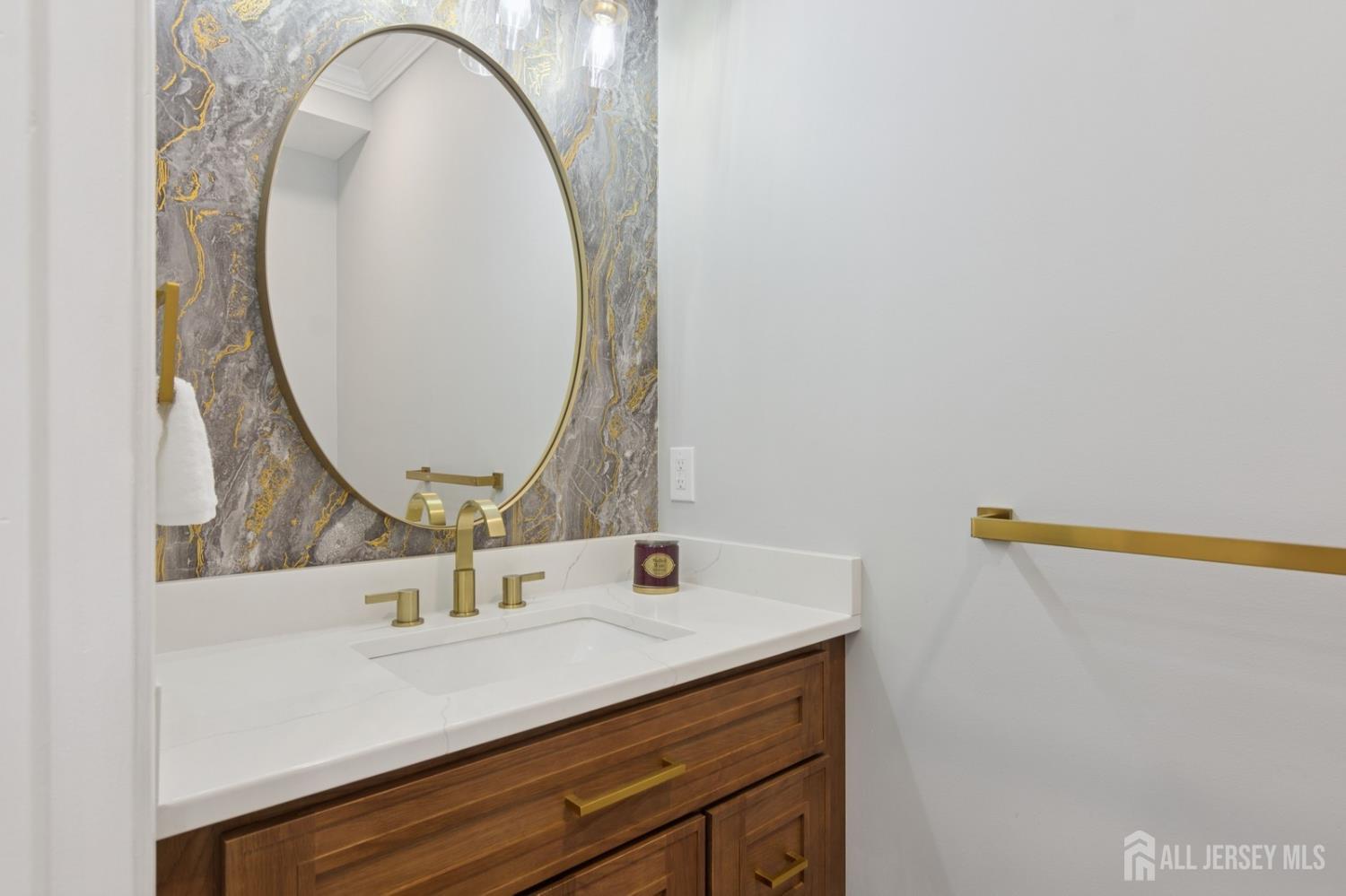 831 West Inman Avenue Rahway, NJ 07065 - Photo 18 of 35 a bathroom with a sink and a mirror