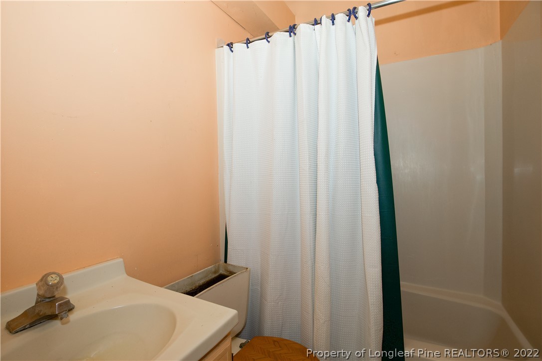453 Heritage Farm Road Carthage, NC 28327 - Photo 14 of 50 a bathroom with a sink and vanity