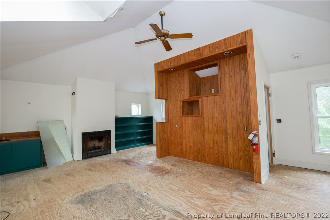 453 Heritage Farm Road Carthage, NC 28327 - Photo 25 of 50 a view of empty room with wooden floor and ceiling fan
