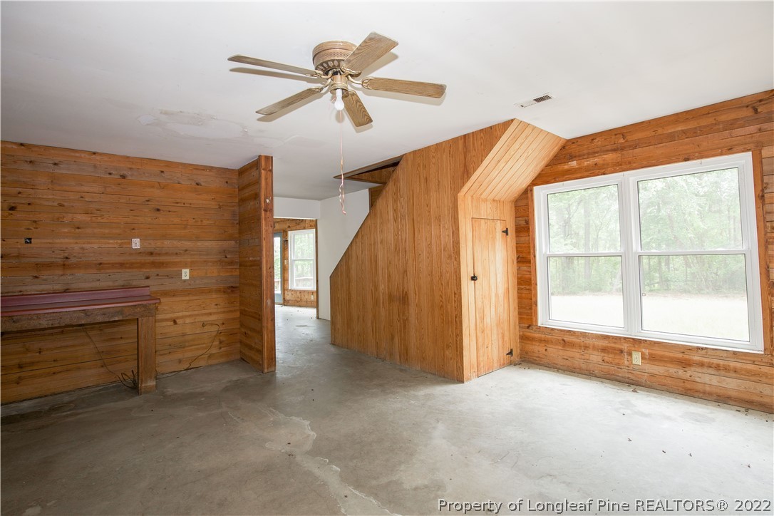 453 Heritage Farm Road Carthage, NC 28327 - Photo 9 of 50 a view of a livingroom with a ceiling fan and window